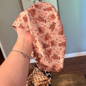 Gingerbread man themed scrub cap.